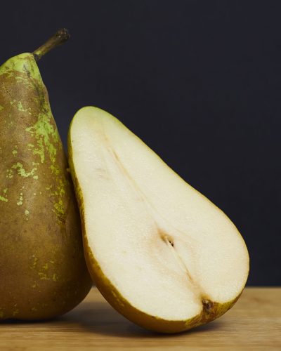 A closeup shot of half-cut of juicy pear