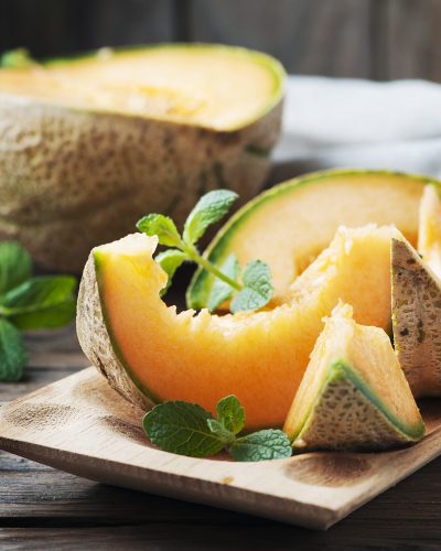 Fresh sweet orange melon and mint, selective focus